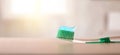 Oral hygiene with toothbrush with toothpaste on table in bathroom Royalty Free Stock Photo