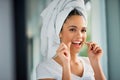 Oral hygiene is vital to a healthy lifestyle. an attractive young woman flossing her teeth at home. Royalty Free Stock Photo