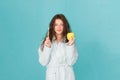 Oral hygiene. Woman bathrobe hold toothbrush and apple. Personal hygiene. Girl cleaning teeth. Freshness and cleanliness