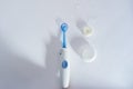 Oral irrigator for teeth versus floss irrigator for teeth top view on white background Royalty Free Stock Photo