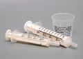 Oral Medicine Syringes and Cup Royalty Free Stock Photo