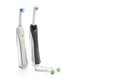 Oralcare Concepts. Pair of Professional Electric Toothbrushes With Spare Attachments Placed Together on White