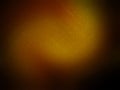 Orange abstract grained on dark background