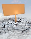 Orange advertisement board stuck in rocky ground Royalty Free Stock Photo