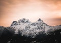 Orange alpen glow behind Sky Pilot Mountain in British Columbia Royalty Free Stock Photo