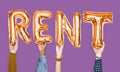 Orange alphabet balloons forming the word rent