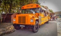 Orange american bus turned into mobile fast food Royalty Free Stock Photo