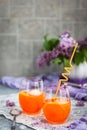 Orange Aperol Spritz cocktail served in a wine glasses