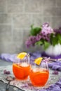 Orange Aperol Spritz cocktail served in a wine glasses