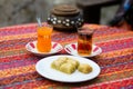Orange and apple Turkish tea with baklawa Royalty Free Stock Photo