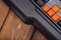 Orange arrow keys on a black keyboard, up, down, left, right buttons on a gaming computer keyboard Royalty Free Stock Photo