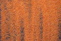 Orange artificial sand on black table for background