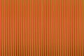 Orange background with green stripes vertical lines bright pattern Royalty Free Stock Photo