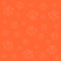 Dog paw.Orange background and light orange dog tracks. Pattern with traces. Royalty Free Stock Photo