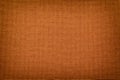 Orange background from a textile material with wicker pattern, closeup Royalty Free Stock Photo