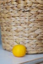 orange on the background of a wicker basket. citrus tree in a wicker basket