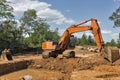 Orange backhoe on construction site