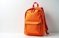 Orange backpack on white background. Modern bag for school, travel or daily use. Minimalist object for education or student Royalty Free Stock Photo