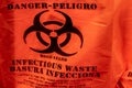 Orange bag with biohazard warning and symbol