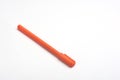 Orange ball pen on a white background Royalty Free Stock Photo