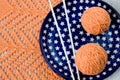 Orange balls, knitted pattern and nedles