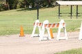 Orange barricades on walking path