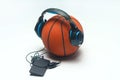 Orange basket ball, headphone and mobile phone. Royalty Free Stock Photo