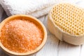 Orange bath salt in wooden bowl