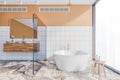 Orange bathroom interior, tub and sink, front view
