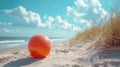 Orange Beach Ball on Sandy Dunes Under Blue Sky