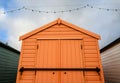 An orange beach hut in Felixstowe, UK. Royalty Free Stock Photo