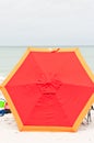 Orange beach umbrella, laying on it`s side Royalty Free Stock Photo