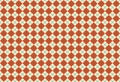 Orange and beige lozenges or diamonds crossed by green stripes, retro argyle pattern in autumnal color tones with bold details