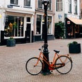 Orange bicycles in a quiet town
