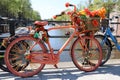 Orange bike canal Amsterdam