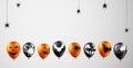 Orange and black balloons on light grey background Royalty Free Stock Photo