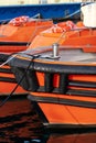 Orange and black boats moored in the port - Italy Royalty Free Stock Photo