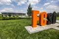 Orange black letters FC SD means Football Club Shakhtar Donetsk on background of Donbass Arena stadium. Donetsk, Ukraine Royalty Free Stock Photo