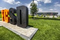 Orange black letters FC SD means Football Club Shakhtar Donetsk on background of Donbass Arena stadium. Donetsk, Ukraine Royalty Free Stock Photo