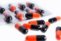 Orange and black pills Royalty Free Stock Photo