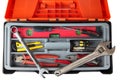 Orange black plastic toolbox with set of old hand tools. Royalty Free Stock Photo