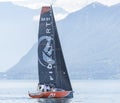 An orange and black sailing boatCully Regatta