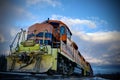 Orange and Black Train with Stormy Sky Royalty Free Stock Photo