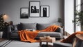 Orange blanket on grey sofa in modern apartment interior with poster and wooden table Royalty Free Stock Photo