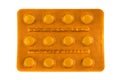 Orange blister pack with pills on white background