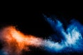 Orange blue color powder explosion on black background Royalty Free Stock Photo
