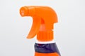 Orange blue colored plastic spray detergent bottle. Cosmetic  container Royalty Free Stock Photo