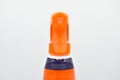 Orange blue colored plastic spray detergent bottle. Cosmetic  container Royalty Free Stock Photo