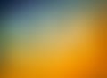 Orange blue and gold background blur, gradient blue sky blurred into orange clouds with smooth texture