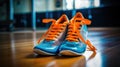 an orange and blue pair of sneakers, with blue laces Royalty Free Stock Photo